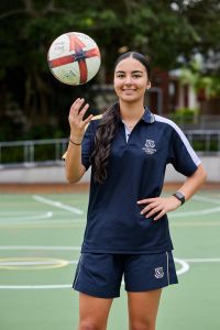 Photo showing a student with a netball